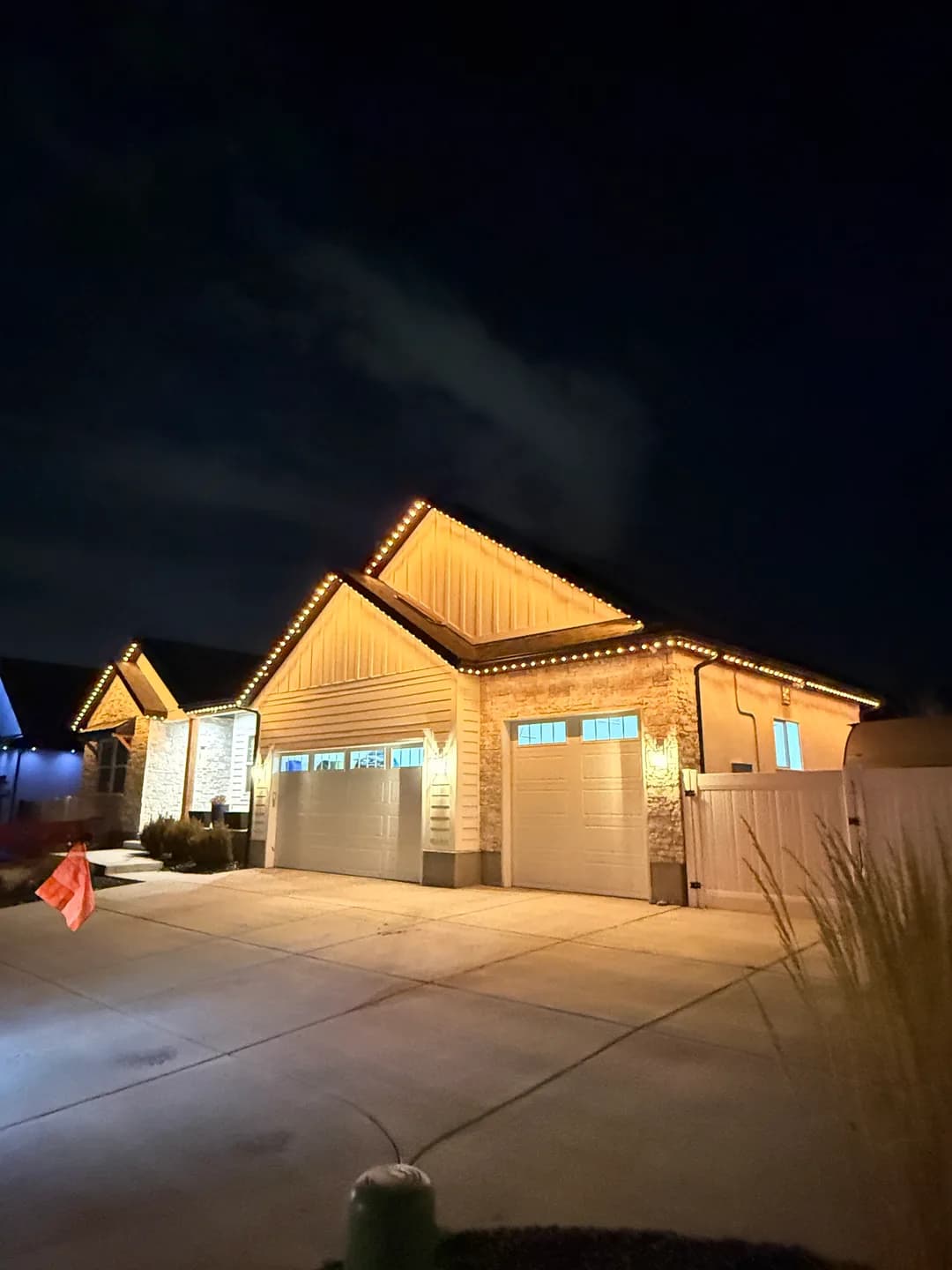 Utah home lit with permanent outdoor LED lighting at dusk
