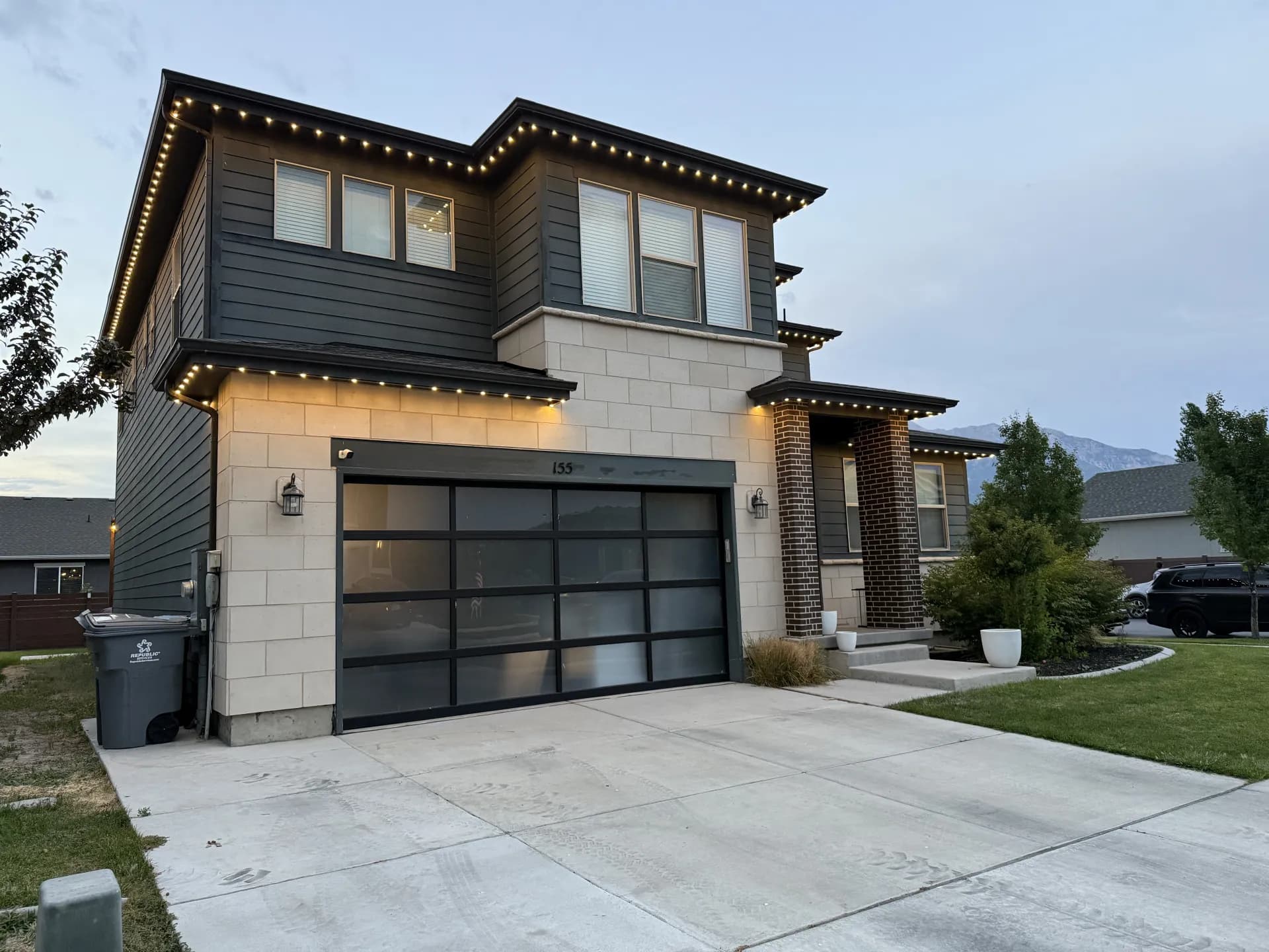 Ranch-style home with warm white permanent LED accent lights
