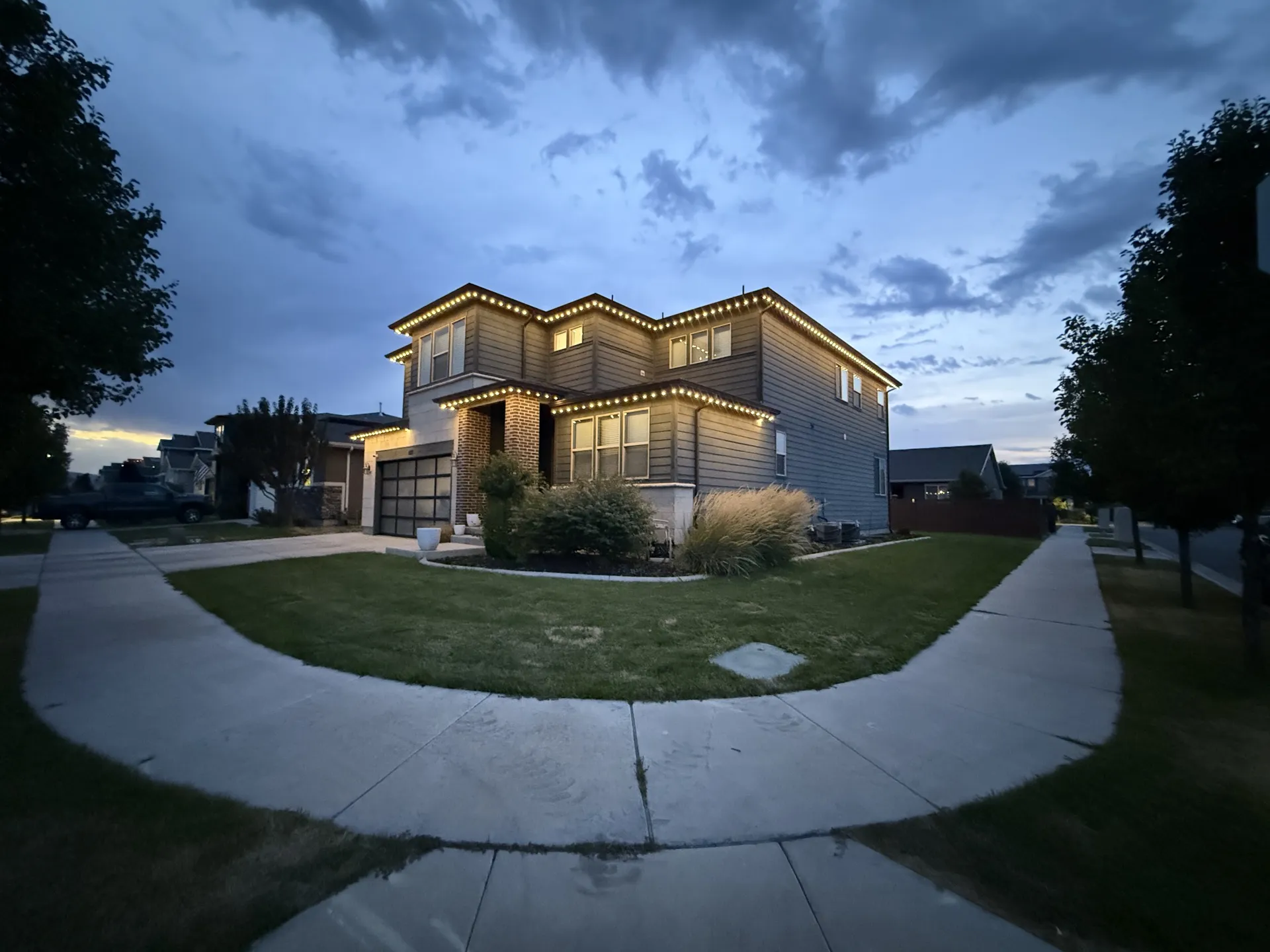 Utah home with permanent LED accent lighting along roofline and garage