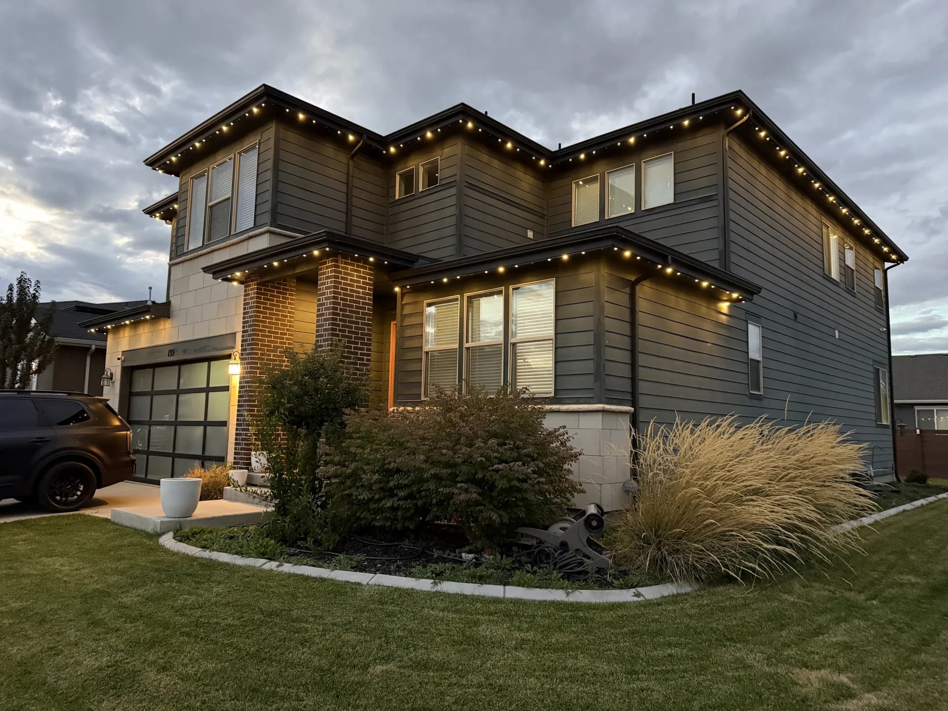 Modern exterior with clean permanent LED light lines along roofline