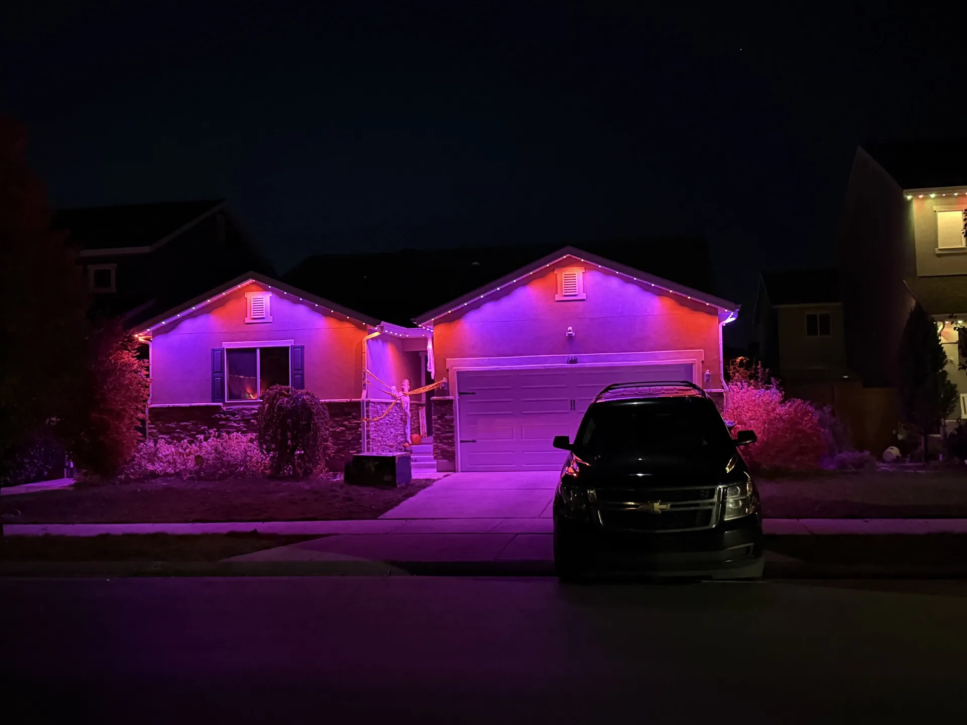 Spacious home with permanent LED lighting along multiple rooflines