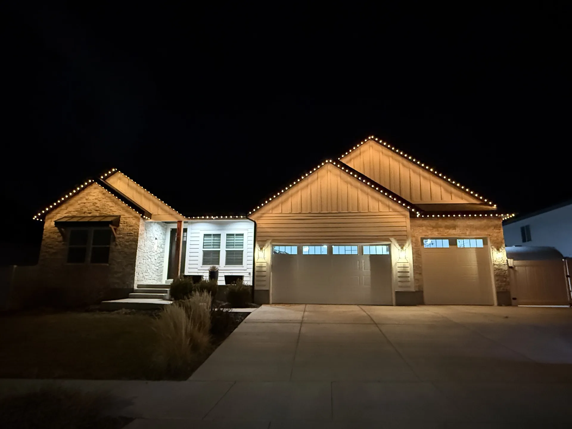 Contemporary home with permanent LED lighting at night